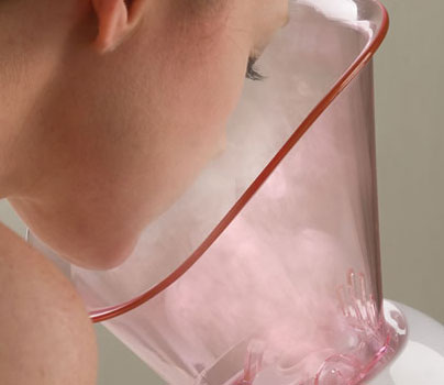 Woman using the facial sauna