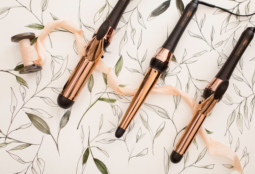 L to R: InfinitiPRO by Conair® Rose Gold Titanium 1½” Curling Iron, 1¼" Curling Wand, and 1" Curling Iron